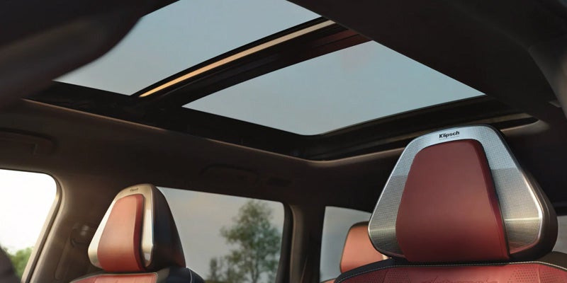 2027 INFINITI QX65 panoramic moonroof interior view.