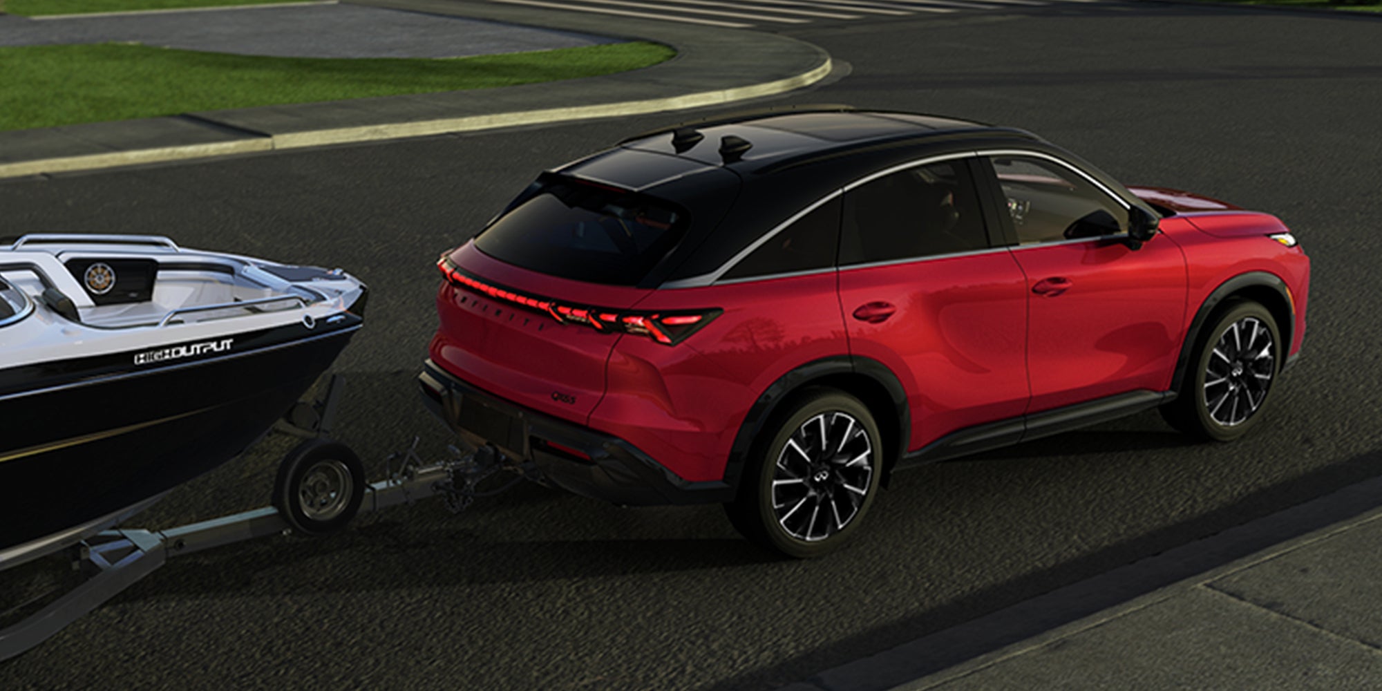 Red 2027 INFINITI QX65 SUV towing a trailer.